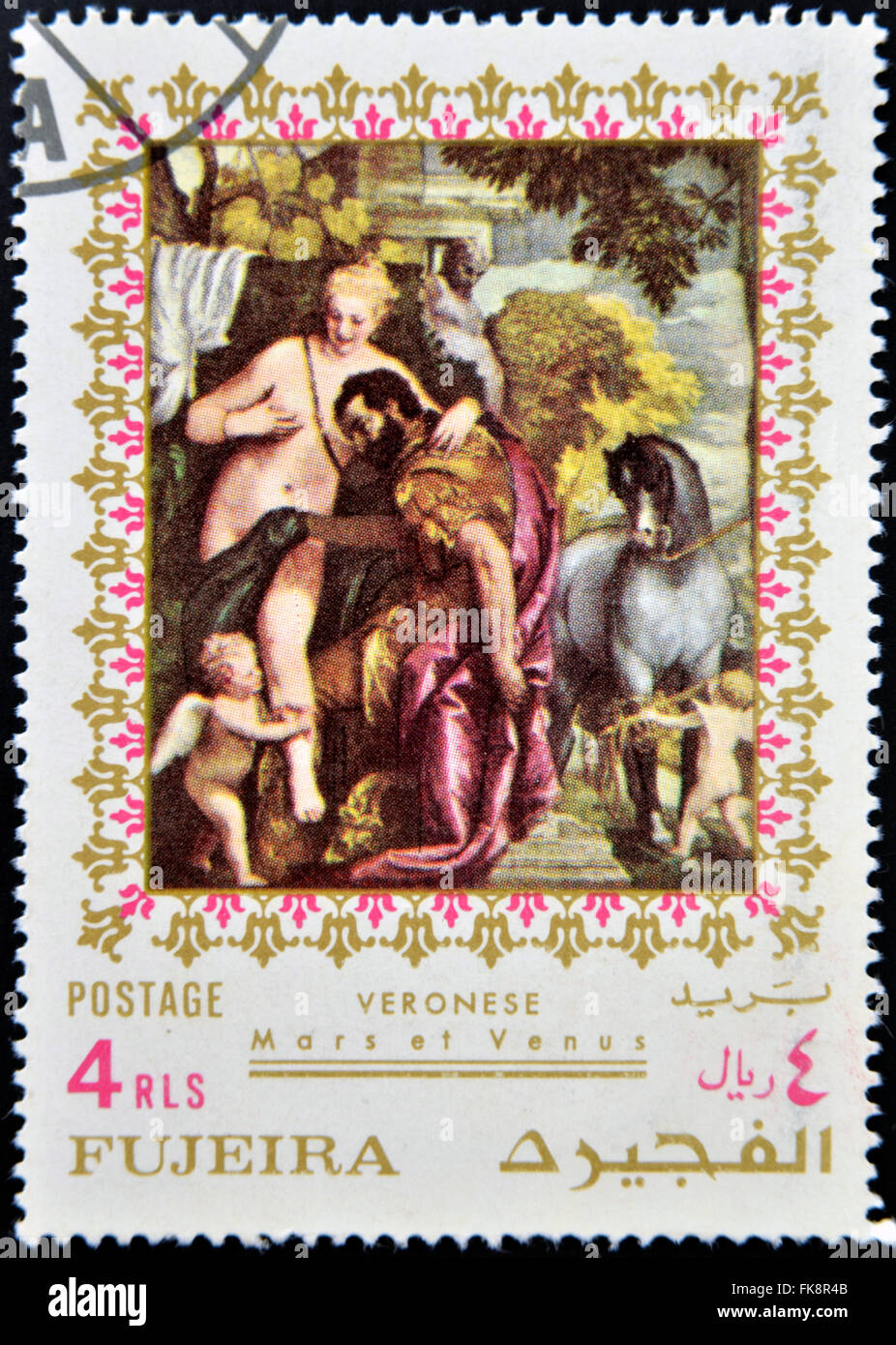 FUJEIRA - CIRCA 1985: Stamp printed in Fujeira shows Mars and Venus United by Love by Paolo Veronese, circa 1985 Stock Photo