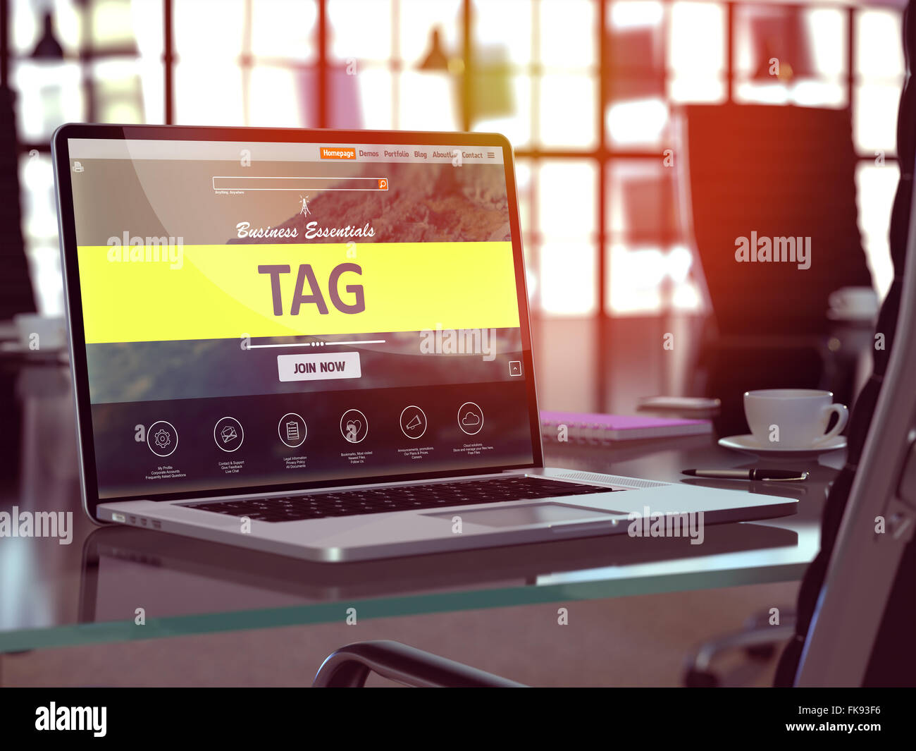 Tag on Laptop in Modern Workplace Background. Stock Photo