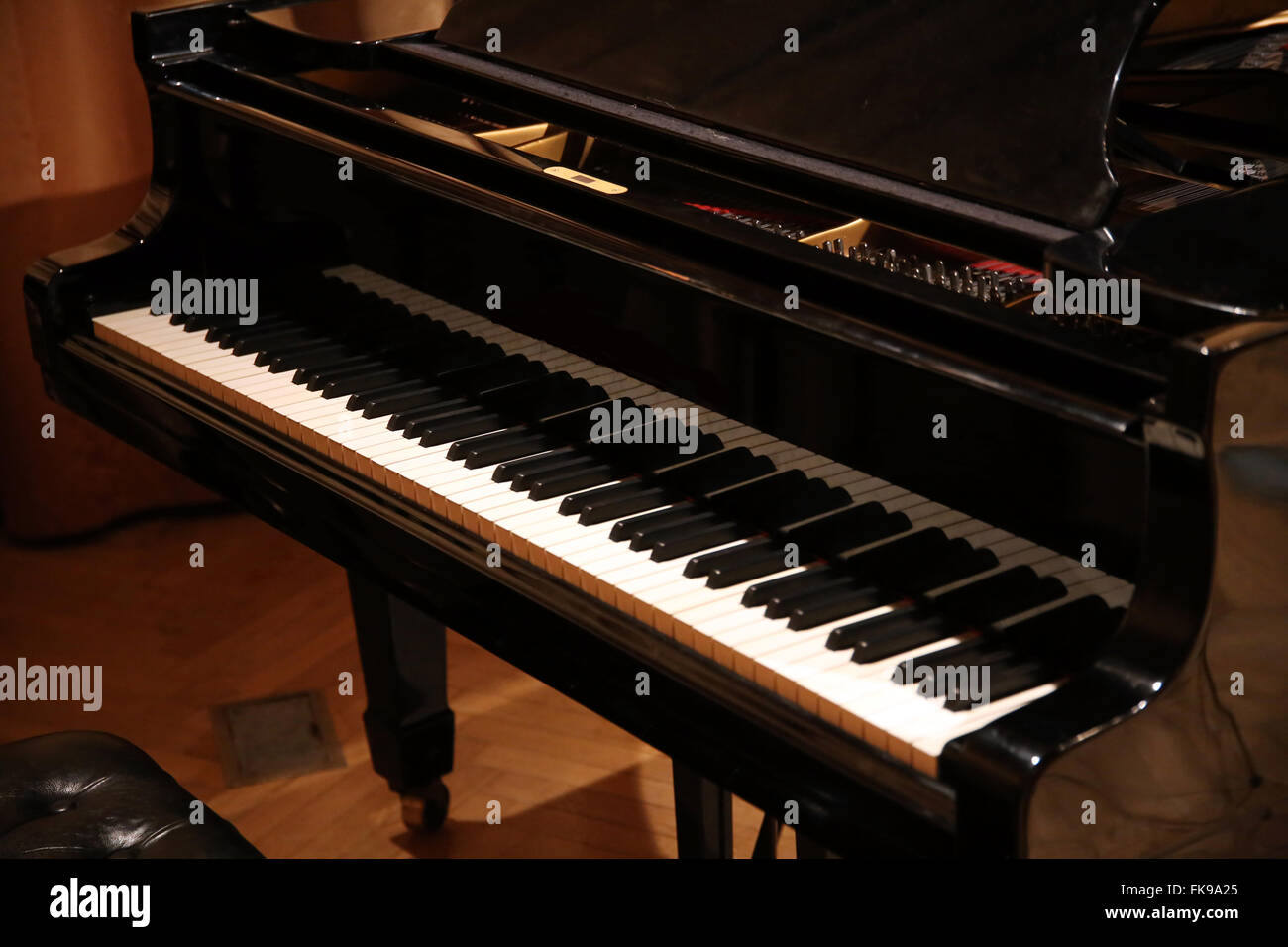 Close up of a grand piano with black and white piano keys Stock Photo