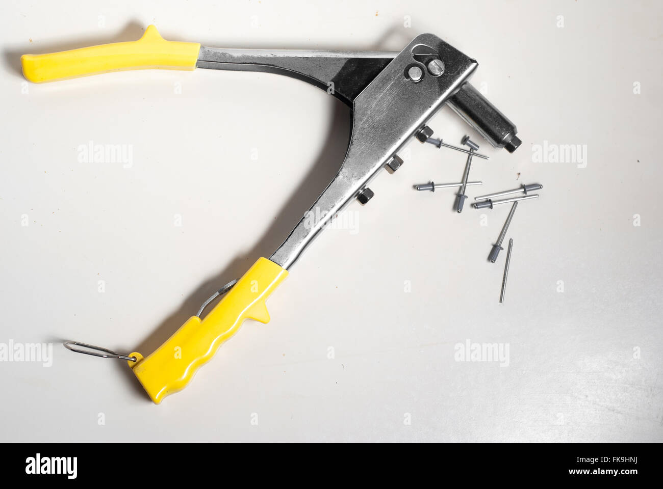 rivets and rivet pliers isolated on white background Stock Photo Alamy
