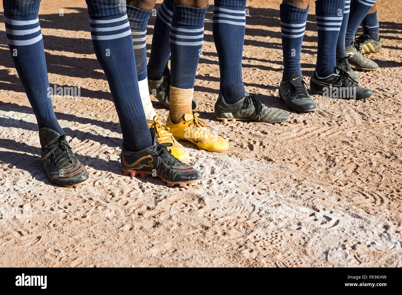 Detail of cleats soccer players of floodplain Stock Photo