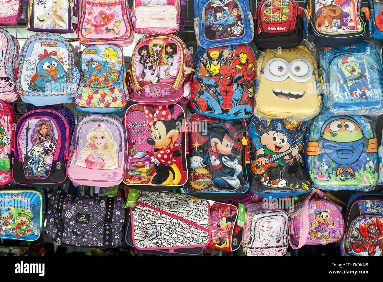Detail of backpacks with cartoon characters for sale in the city center Stock Photo