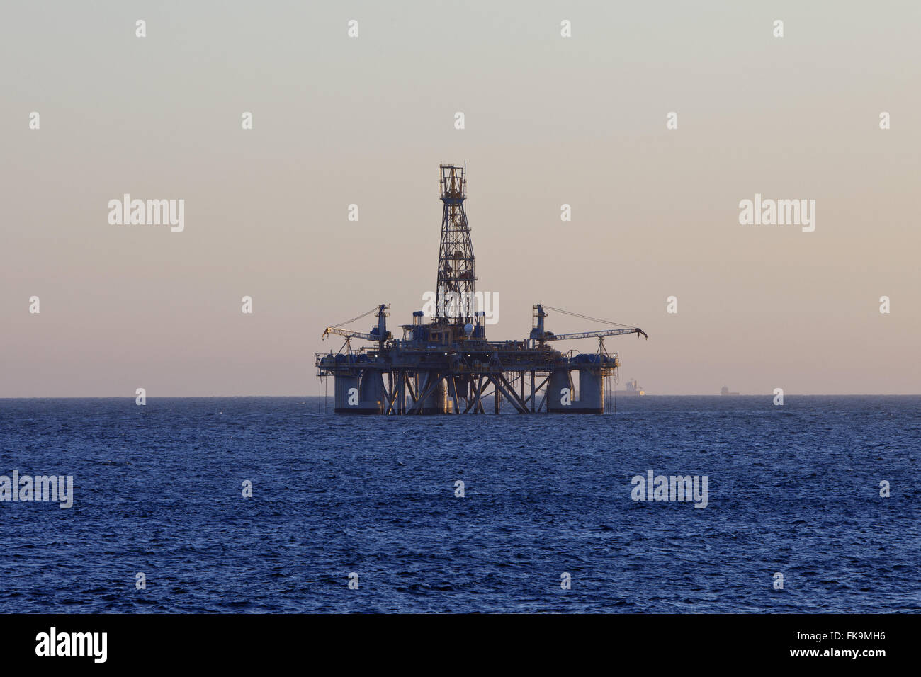The oil platform seen from the beach at dusk Itacoatiara - oceanic region Stock Photo