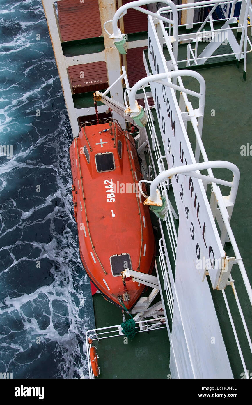 Lifeboat stowed on starboard side of Utrillo Container ship. Stock Photo