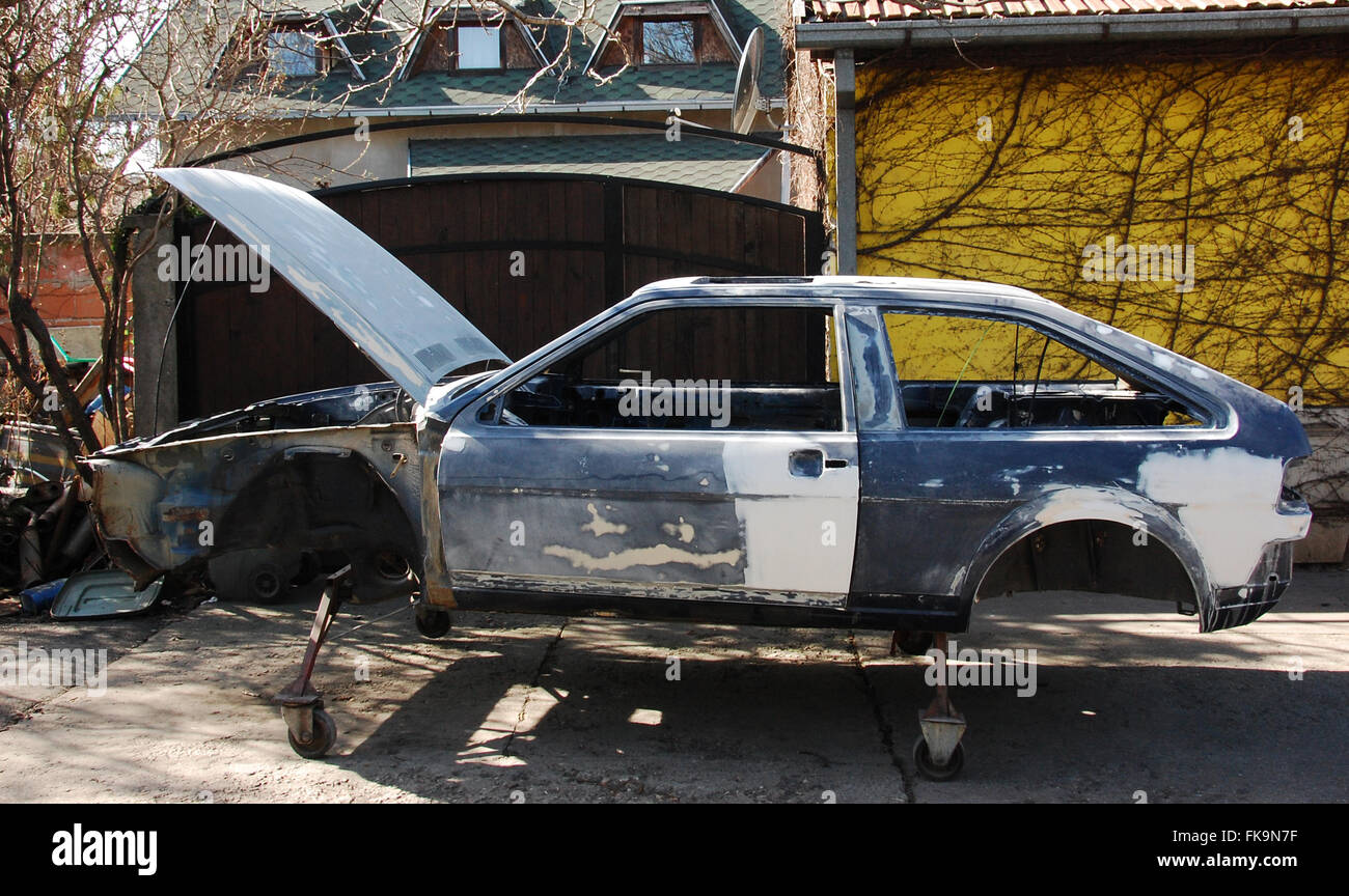 Old car chassis in preparation for painting Stock Photo Alamy