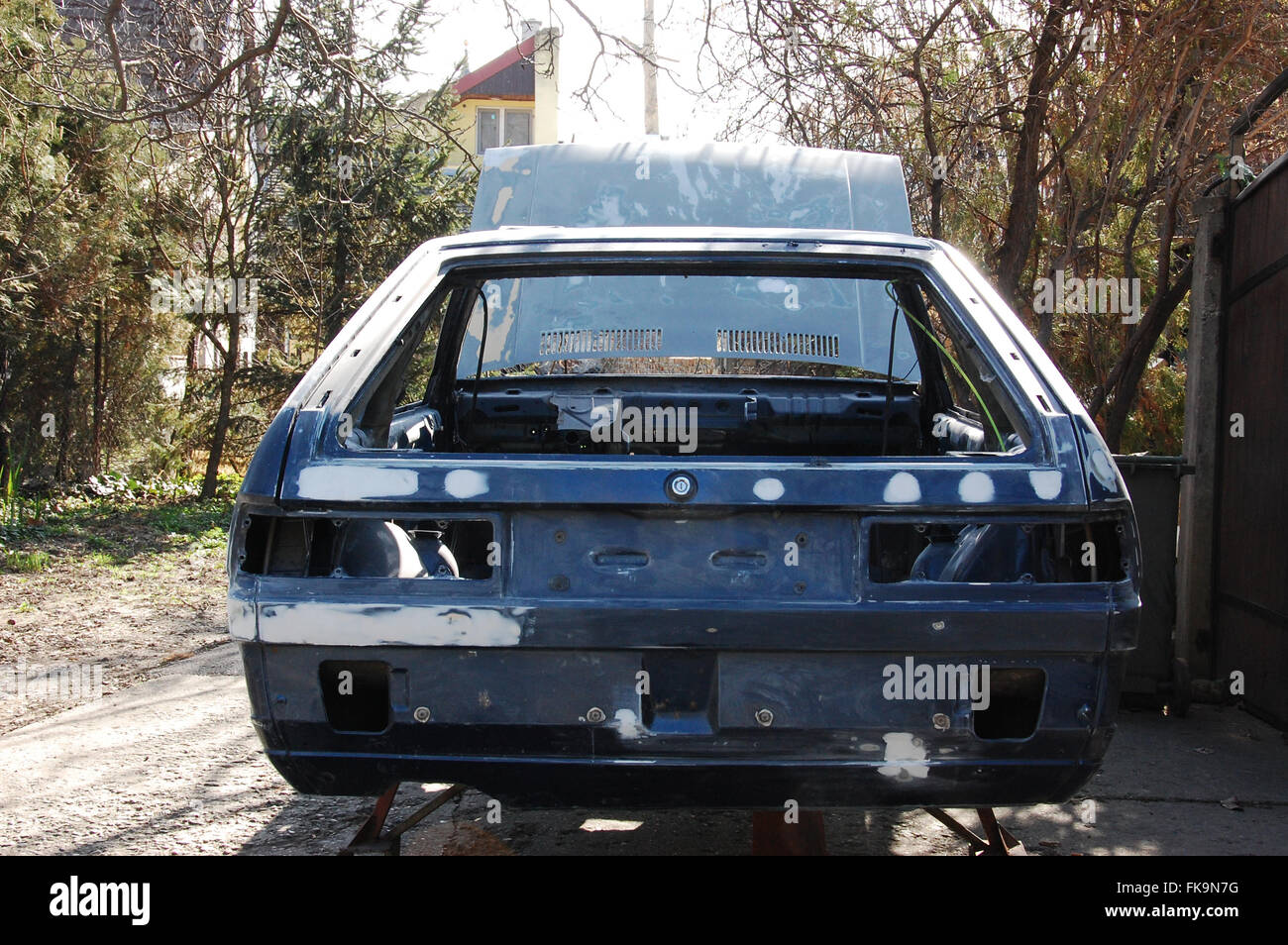 Old car chassis in preparation for painting Stock Photo Alamy