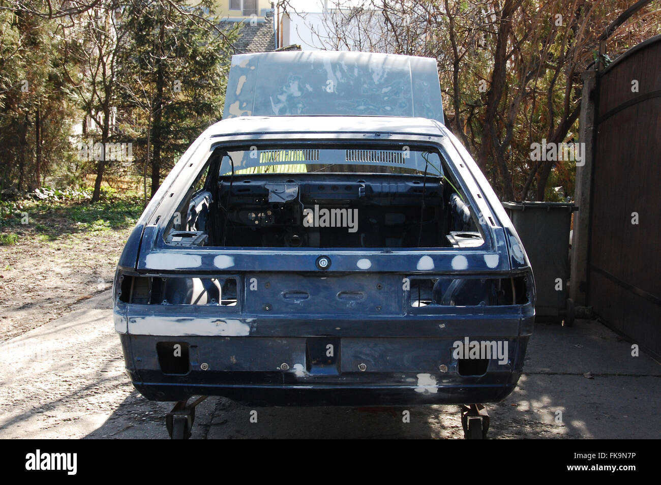 Old car chassis in preparation for painting Stock Photo Alamy