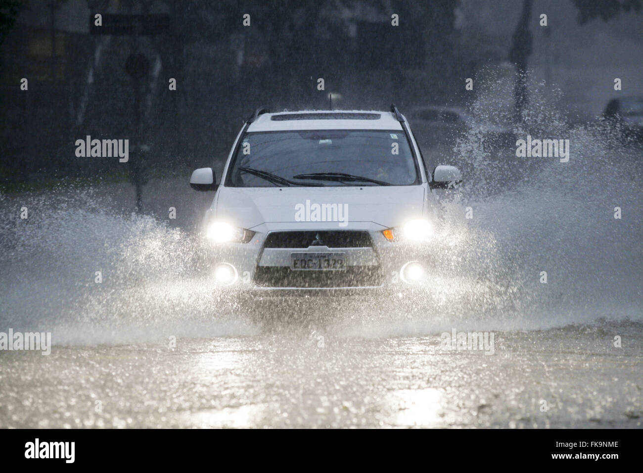 Automobile traveling at a flooded street in the neighborhood of Pompeii - west of the city Stock Photo