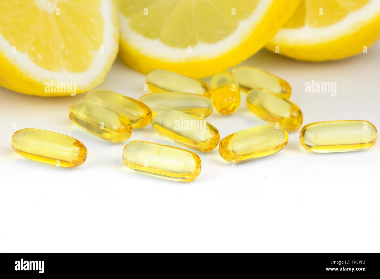 vitamin c pills and lemon slices on white background Stock Photo Alamy
