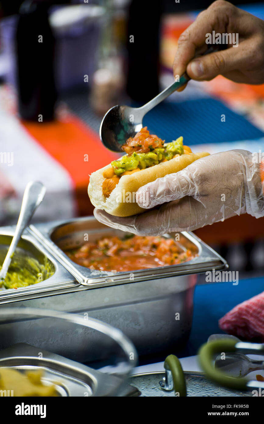 Mexican hotdogs being cooked in the Vila Madalena Gastronomica Fair Stock Photo