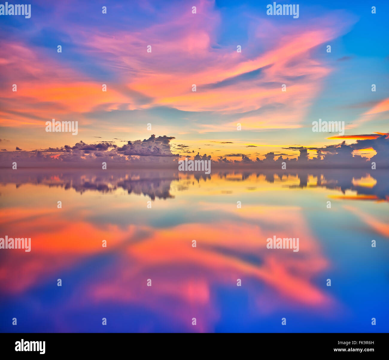 Sunset over ocean Stock Photo - Alamy