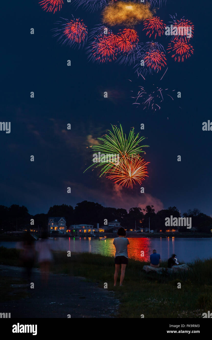Fireworks with people celebrating 4th of July seen in Norwalk park