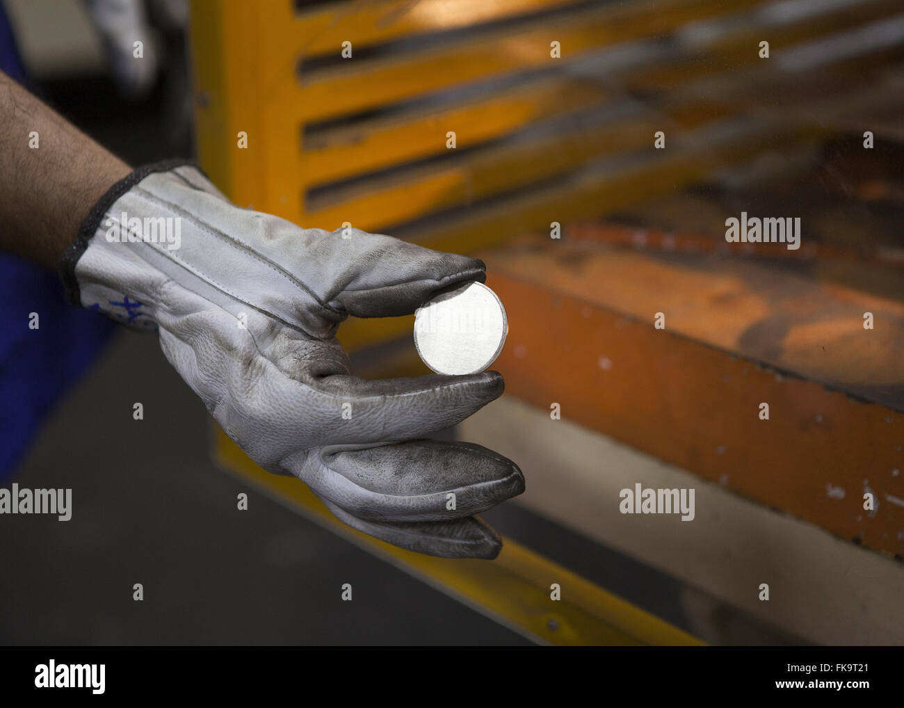 Employee showing cropped currency of the plate array in Mint Stock Photo