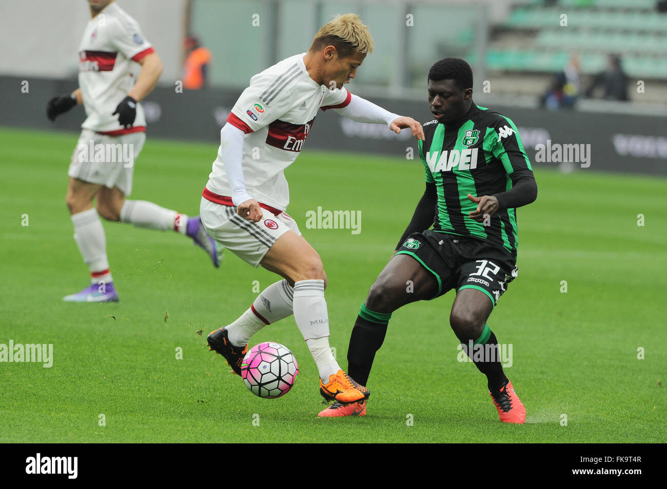 Reggio Emilia, Italy. 06th Mar, 2016. Keisuke Honda Milan's forward and national team of Japan and Joseph Alfred Duncan Sassuolo's midfielder fight for the ball during the Serie A football match between Sassuolo and AC Milan at Mapei Stadium in Reggio Emilia. US Sassuolo Calcio vs AC Milan Serie A football championship 2015/2016. US Sassuolo Calcio wins 2 - 0 over AC Milan. Joseph Alfred Duncan and Nicola Domenico Sansone are the scorers. Credit:  Massimo Morelli/Pacific Press/Alamy Live News Stock Photo