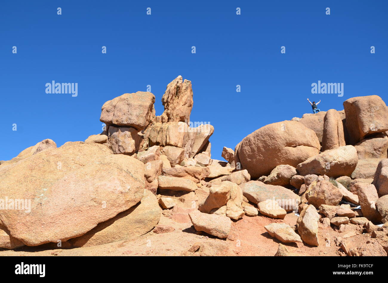 Rock outcropping on Pike's Peak Road, Pike's Peak Colorado, with climber Stock Photo