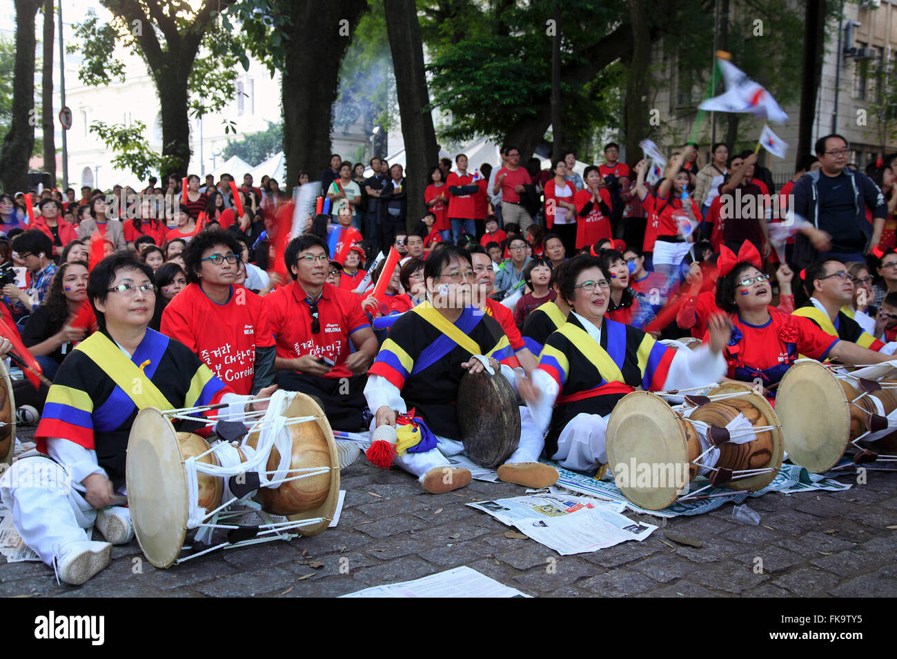 Korean immigrants assist game of his selection in the World Cup in Praca Coronel Fernando Prestes Stock Photo