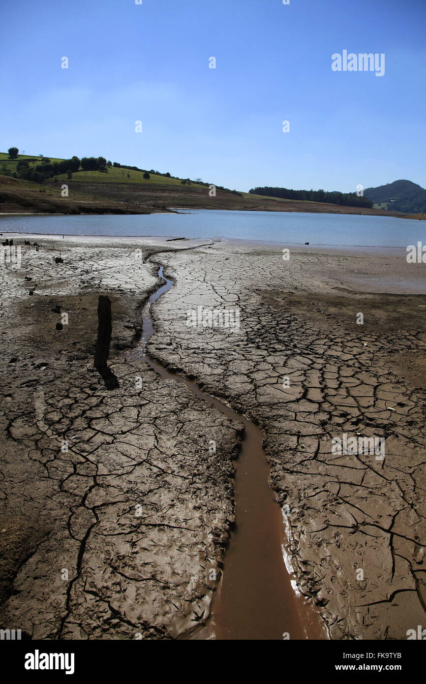 Cracked soil of the dam formed by Jaguari Jacarei and rivers during severe drought Stock Photo