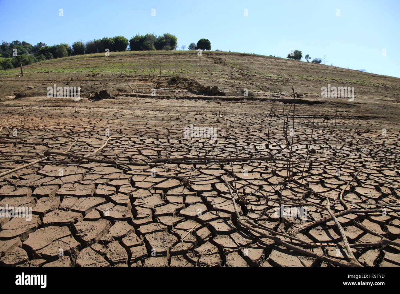Cracked soil of the dam formed by Jaguari Jacarei and rivers during severe drought Stock Photo