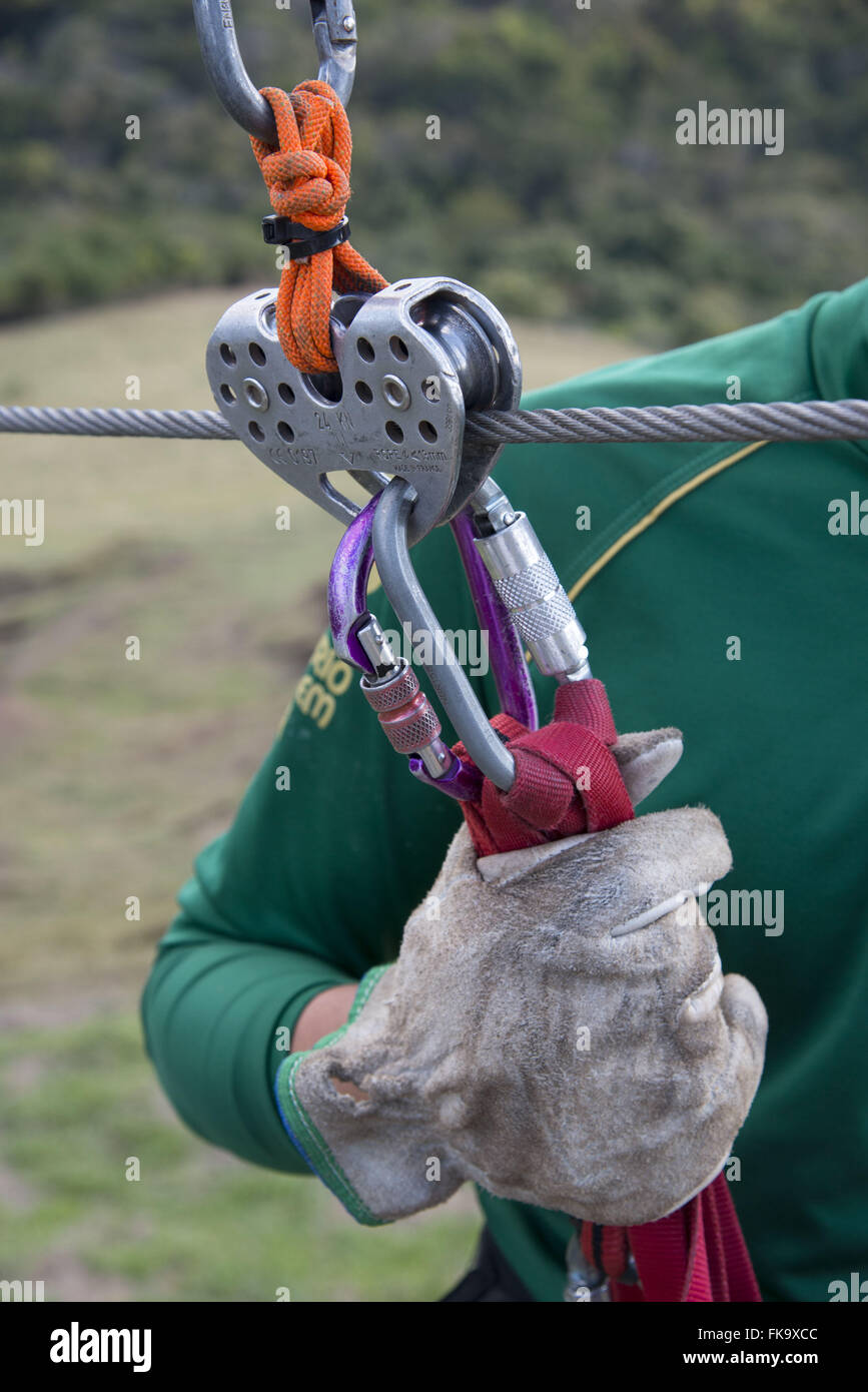 Conductor preparing equipment for practice zipline Stock Photo Alamy