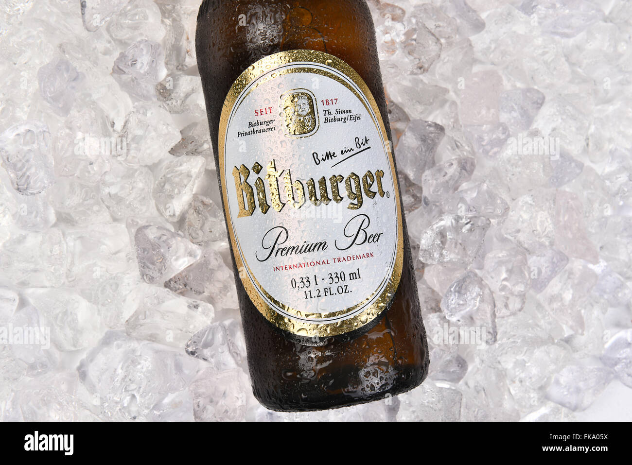 Bitburger Beer bottle on a bed of Ice closeup for a high angle. Stock Photo
