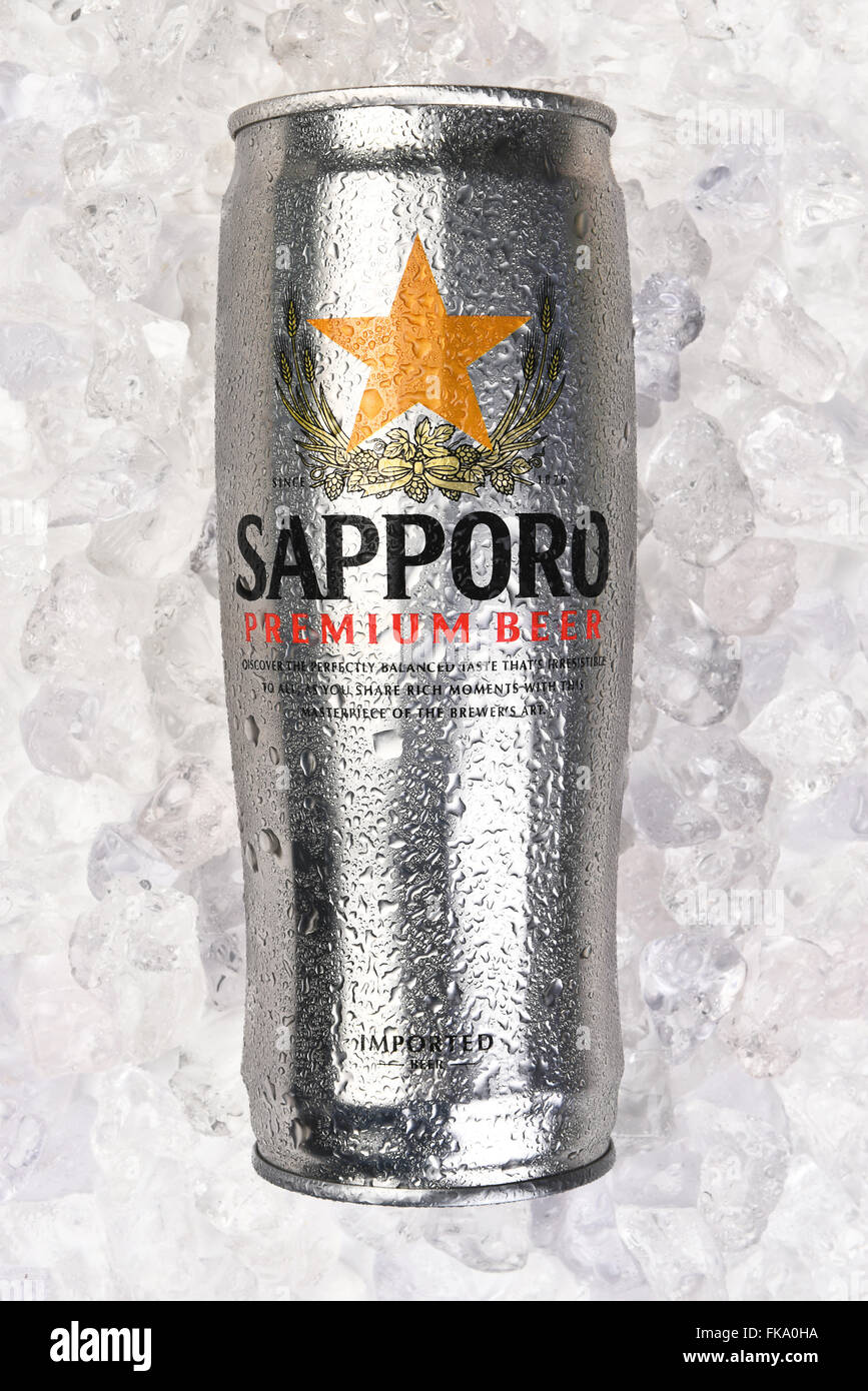Sapporo beer Can on a bed of ice. Vertical format. Stock Photo
