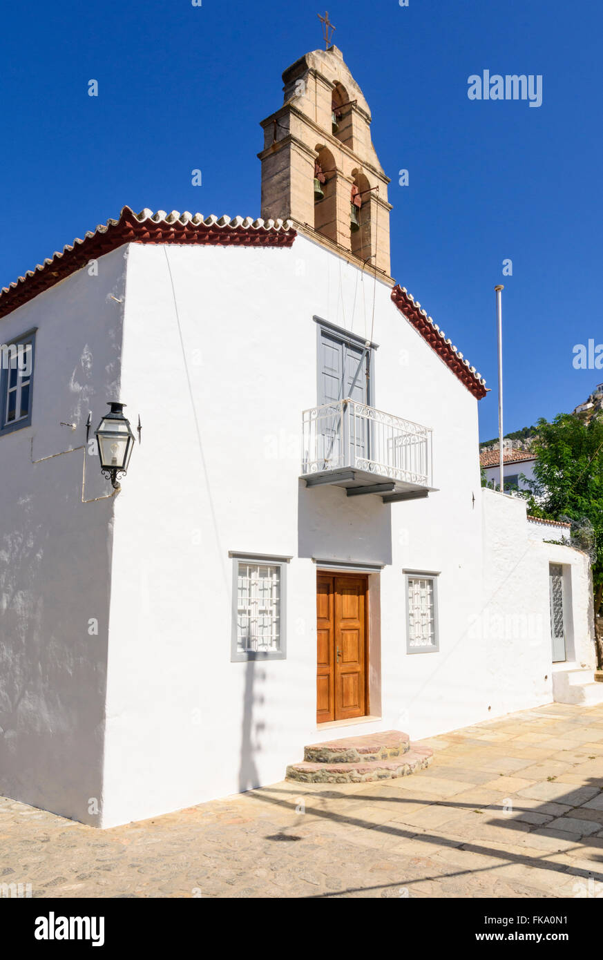 Old white washed church in the back streets of Hydra Town Hydra Island, Greece Stock Photo