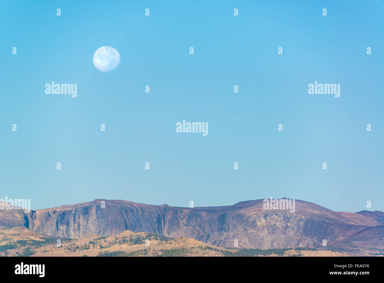 Moon over the Bighorn Mountains in Wyoming Stock Photo