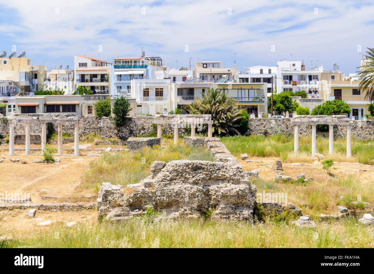 Encroaching urban sprawl of Kos Town overlooking the Ancient Agora archaeological site, Kos Town, Greece Stock Photo