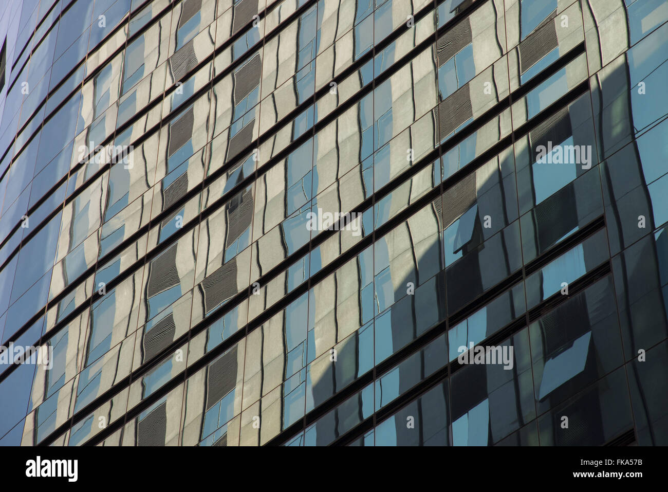 Reflection in glass side of business building in Itaim Stock Photo