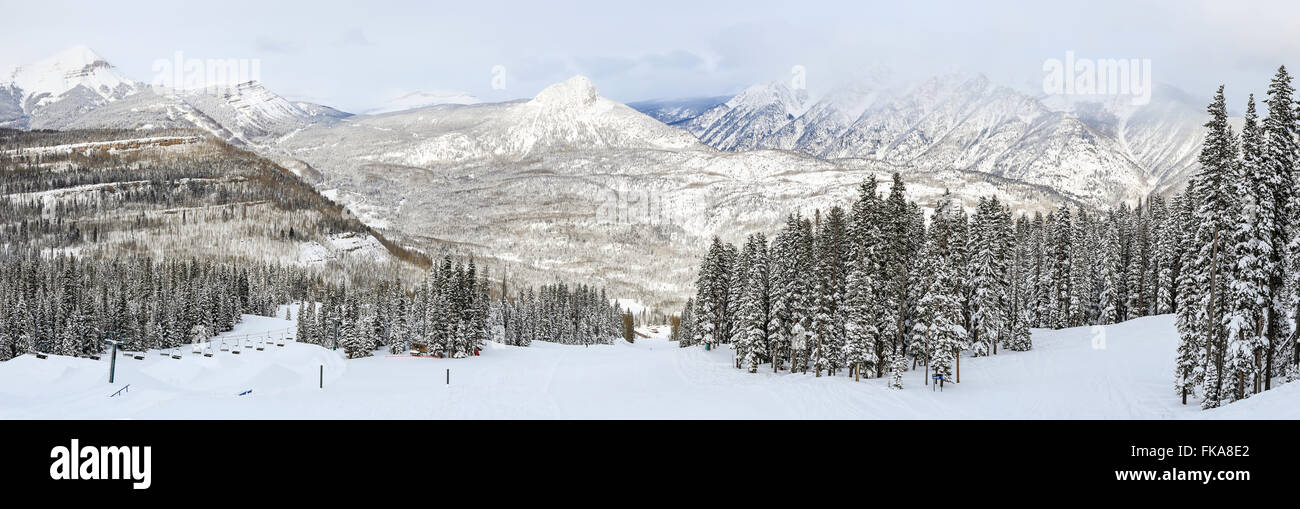 A panoramic view of a ski run at Purgatory Ski Resort, with the Needles mountains in the San Juan National Forest in Colorado. Stock Photo