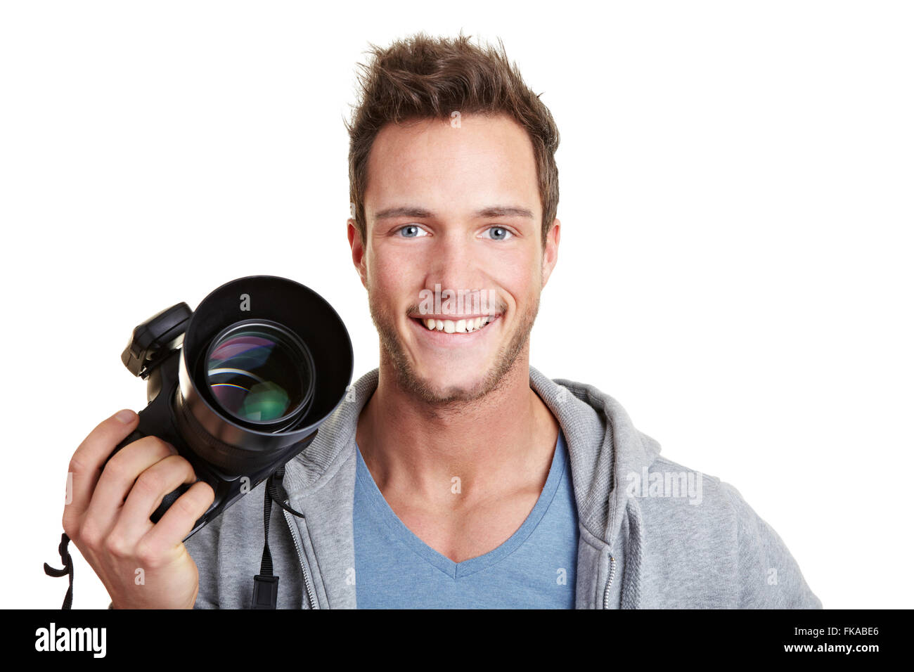 Happy photographer holding digital camera with remote trigger Stock Photo