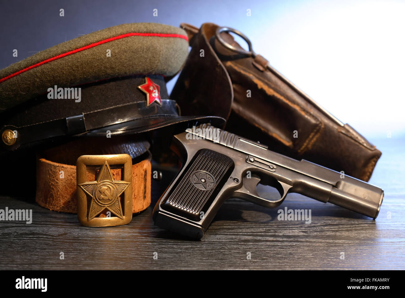 World War II Soviet officer equipment. Military cap near handgun and holster Stock Photo