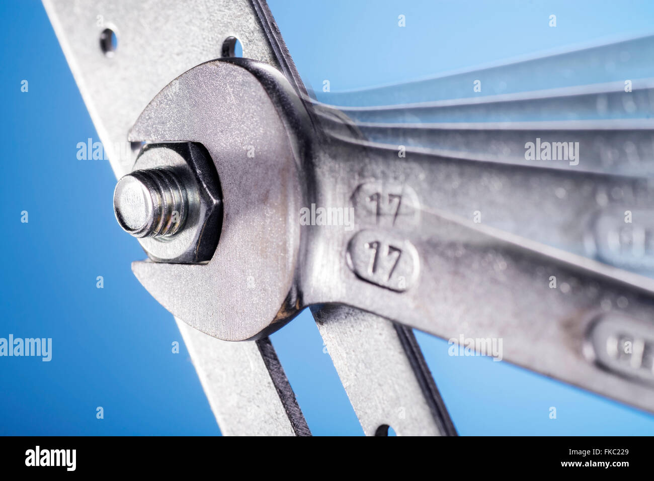 Wrench when tightening a nut Stock Photo