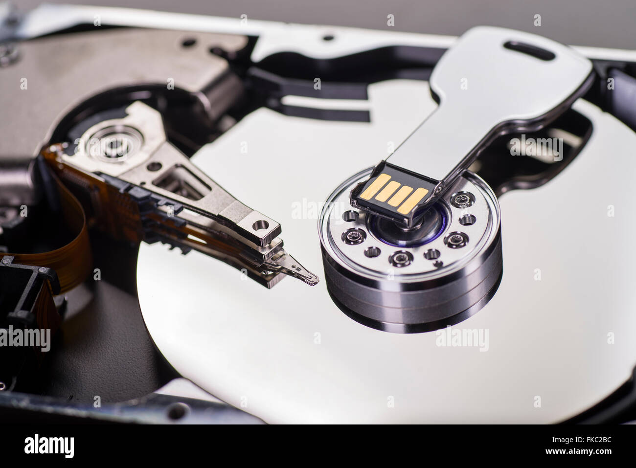 Detail of a hard drive with a USB flash drive Stock Photo