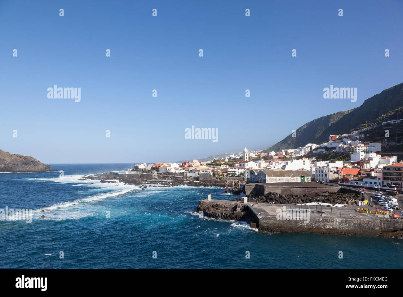 town of garachico on rocky north coast of Tenerife with view over atlantic ocean with blue sky Stock Photo