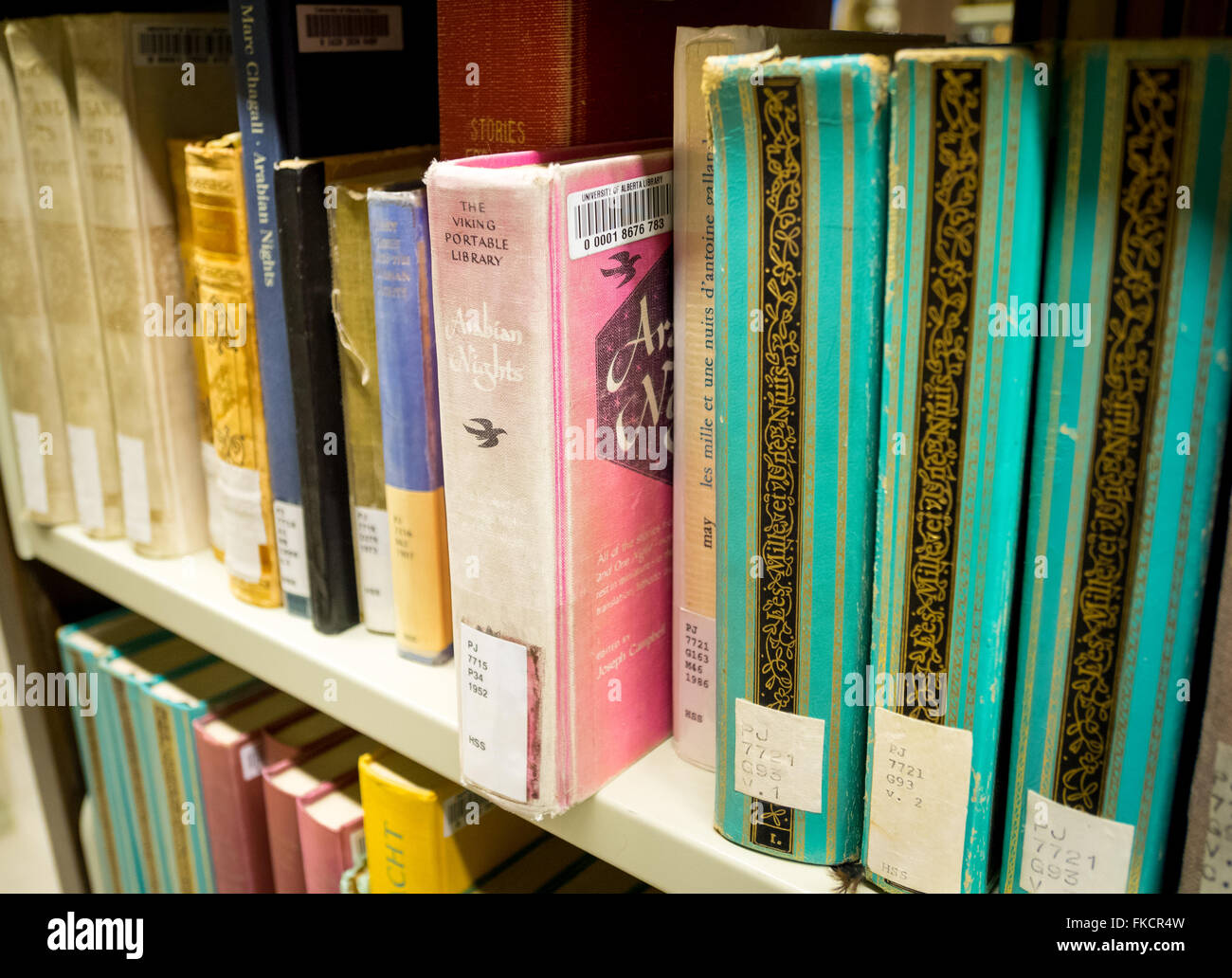A library bookshelf of old Arabian Nights (One Thousand and One Nights) books. Stock Photo
