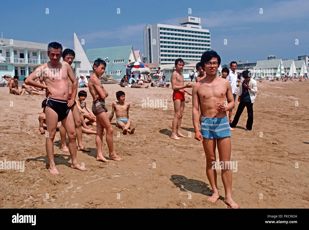 Chinese bathers and holiday makers on Qingdao beach, Shandong Province, China Stock Photo