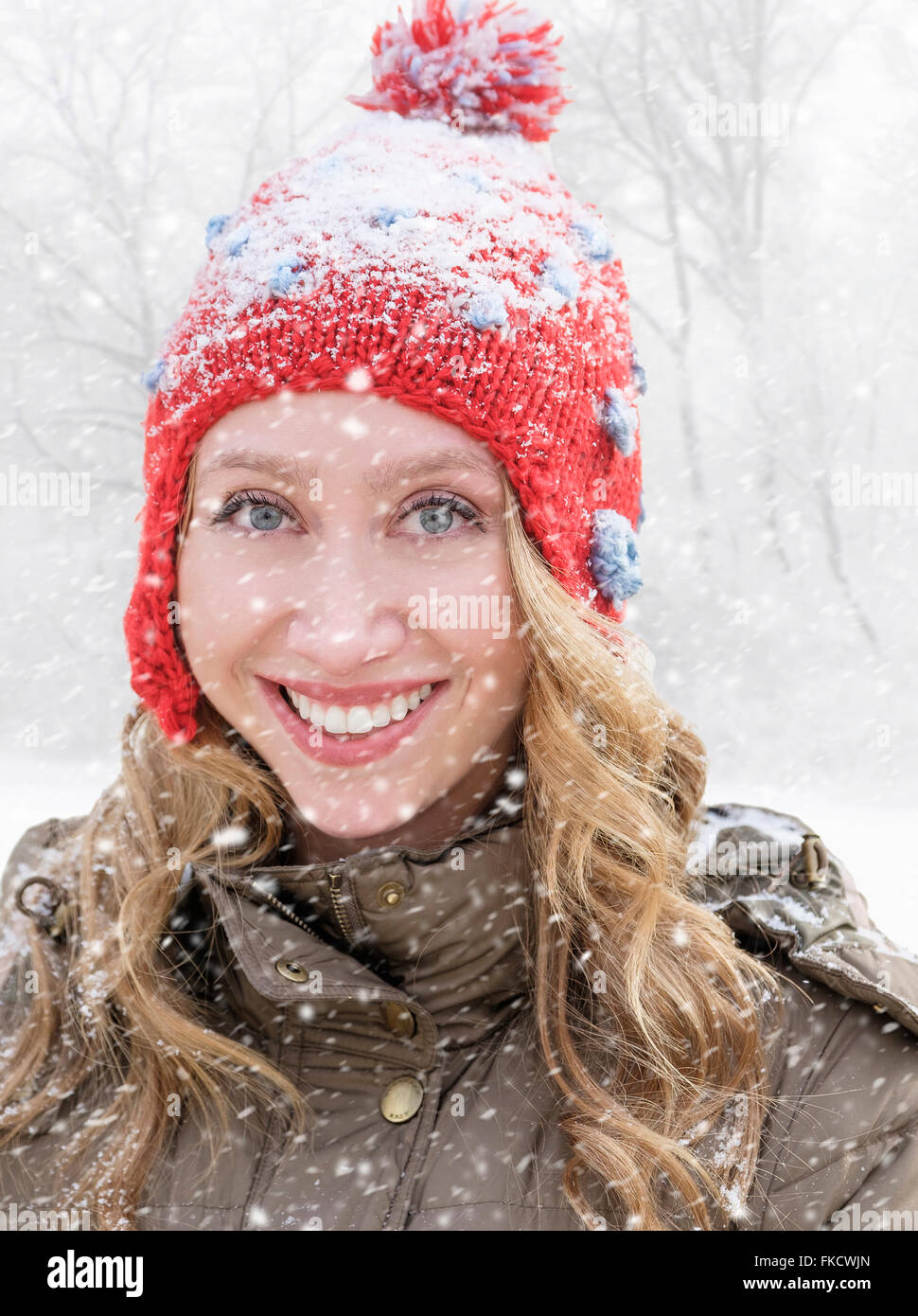 Portrait of woman in red knit hat Stock Photo