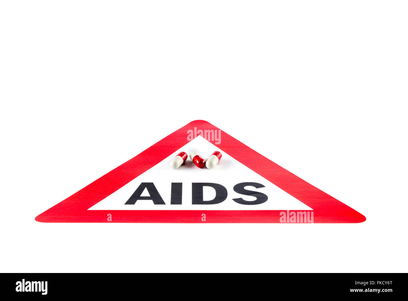 Stop AIDS and HIV, capsule with Warning Sign Social Issues Stock Photo