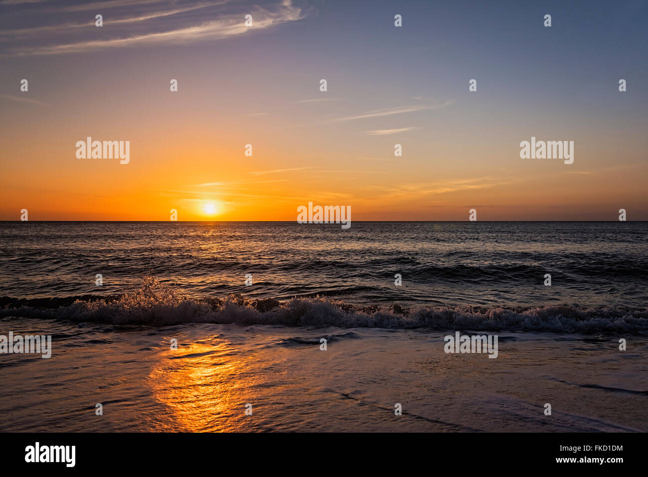 Beach and sea at sunset Stock Photo - Alamy