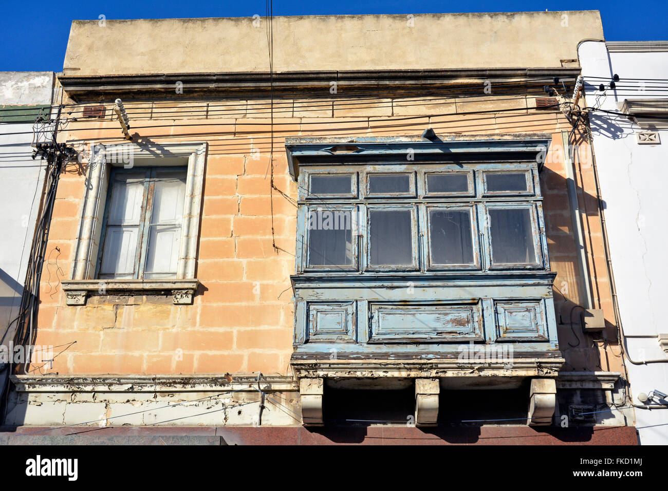Window and balcony of a residential house in Mellieha, Malta on January 27, 2016. Stock Photo