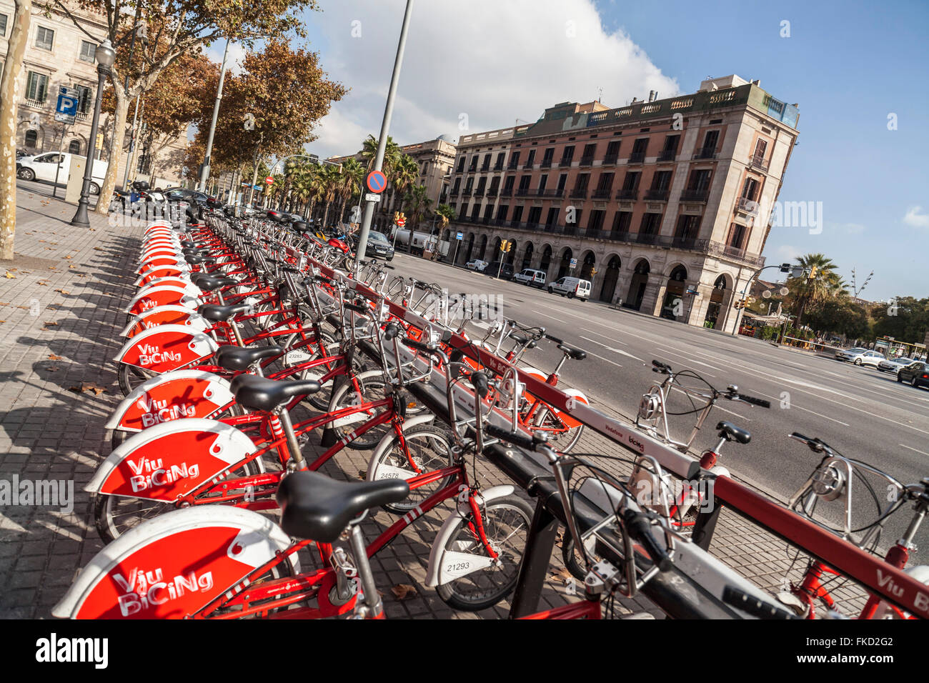 Public bikes and street in Port Vell, Barcelona. Stock Photo