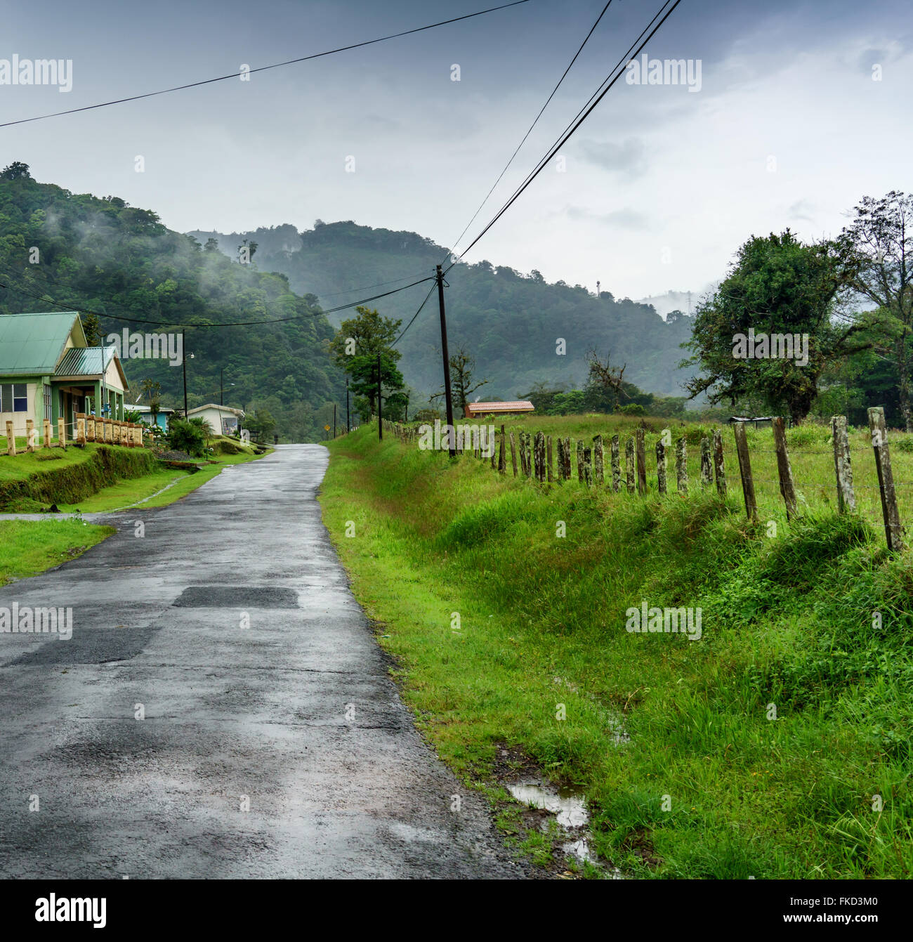 Empty road passing through landscape, Costa Rica Stock Photo