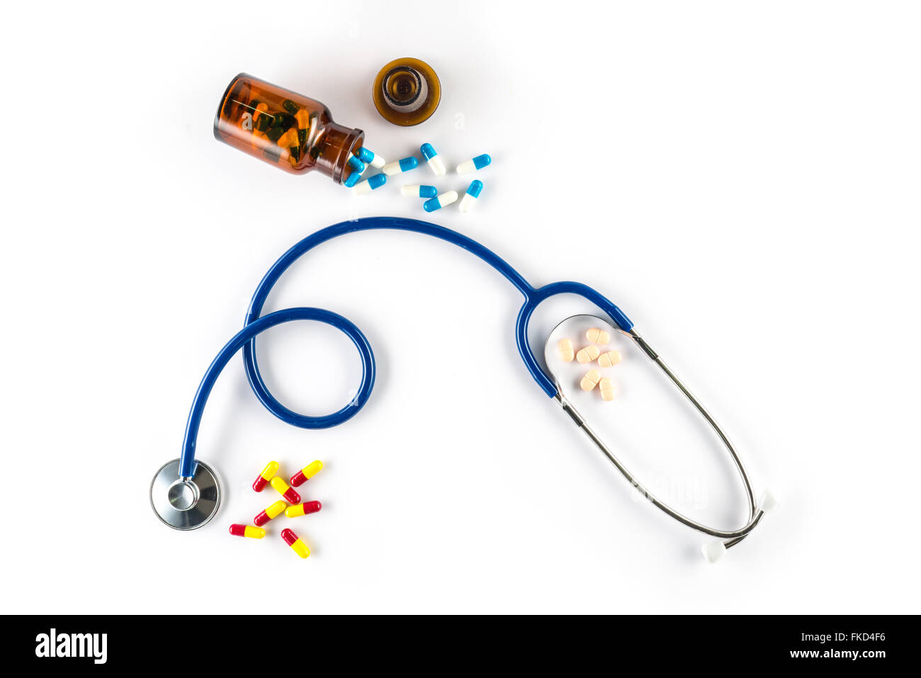 capsule in bottle with Stethoscope and pill cardiology treat Stock Photo