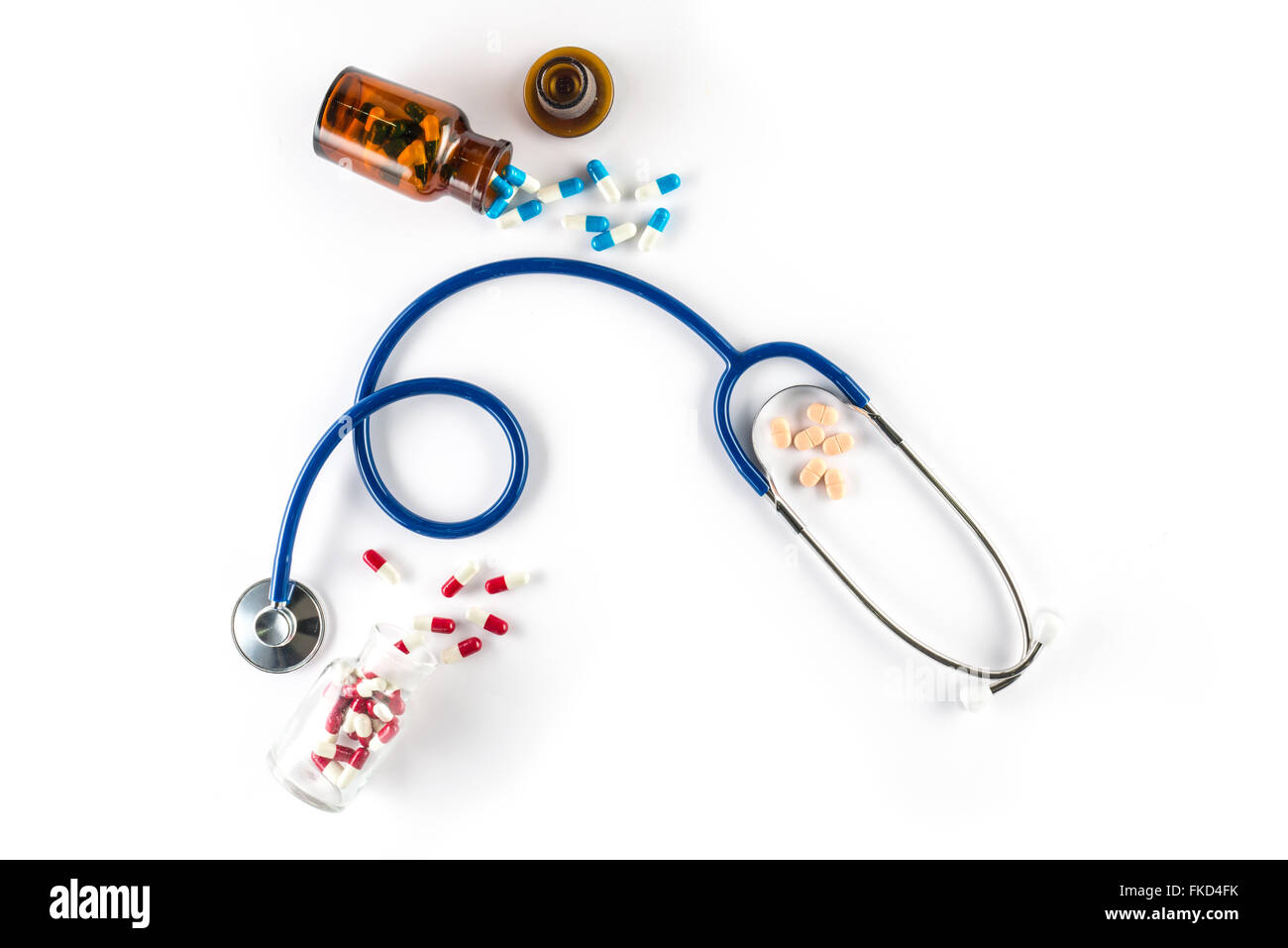capsule in bottle with Stethoscope and pill cardiology  treat Stock Photo