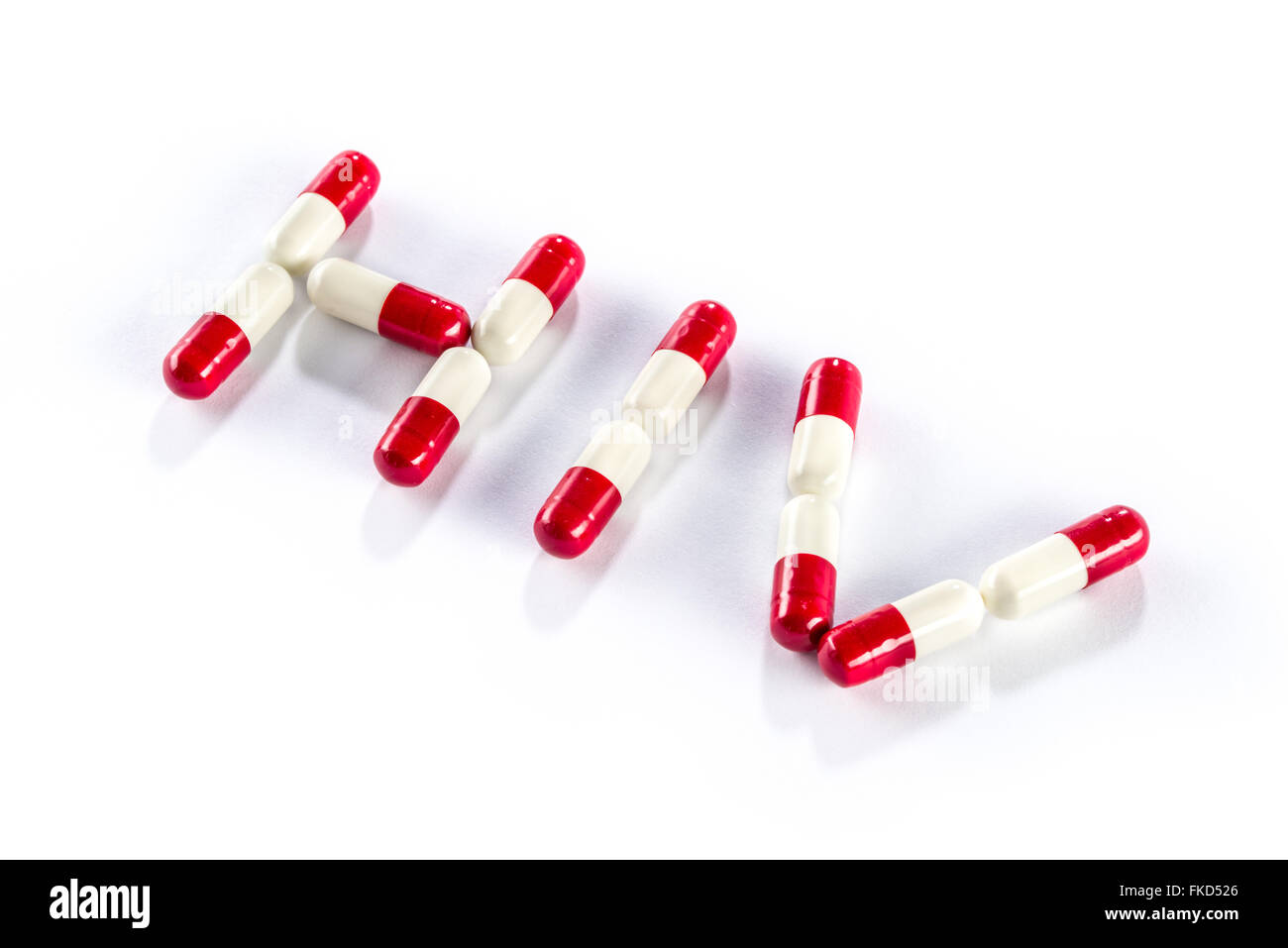 red with white capsule in HIV WORLD, AIDS medication Stock Photo - Alamy