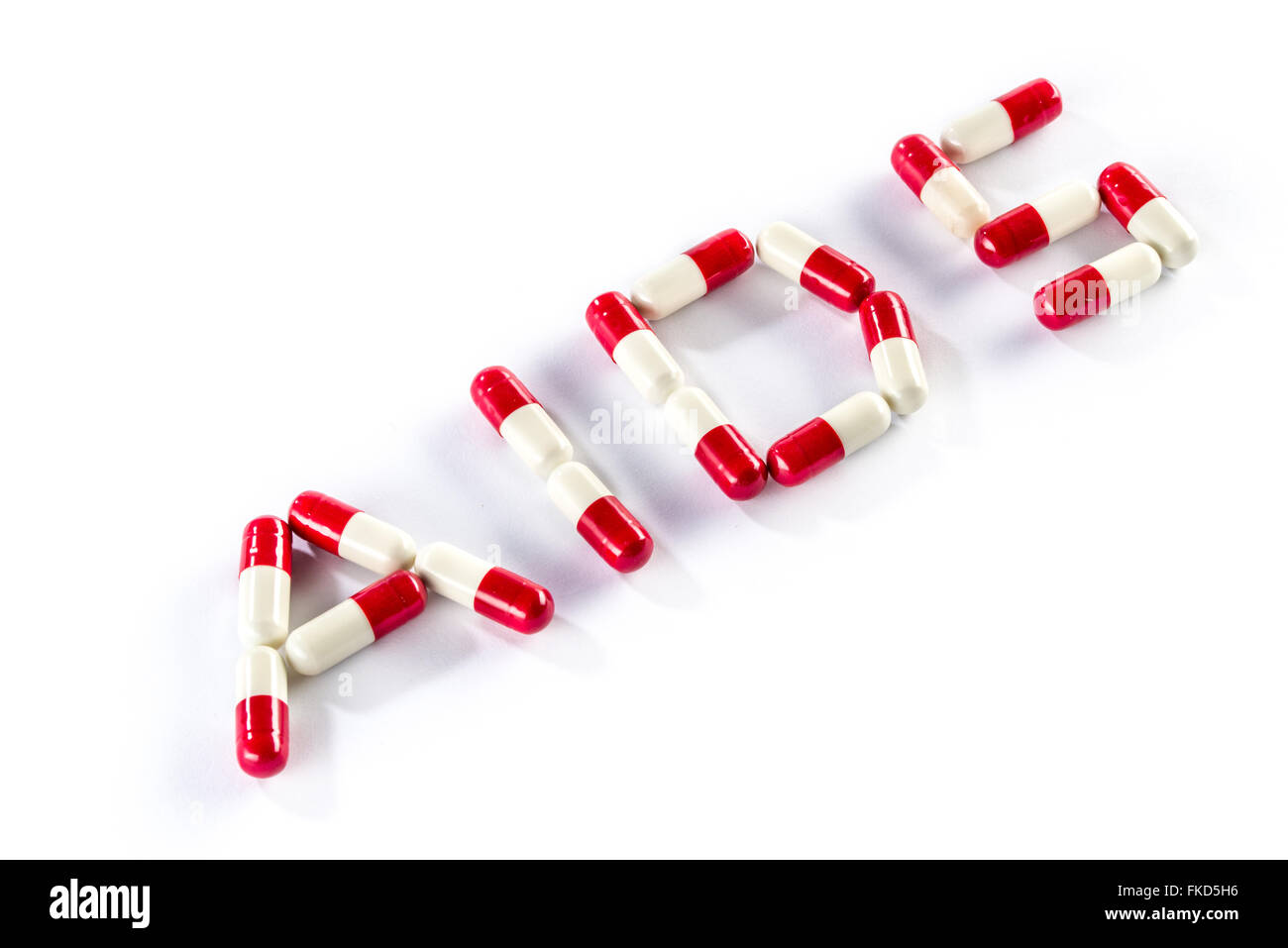 red with white capsule in AIDS WORLD, HIV medication Stock Photo - Alamy