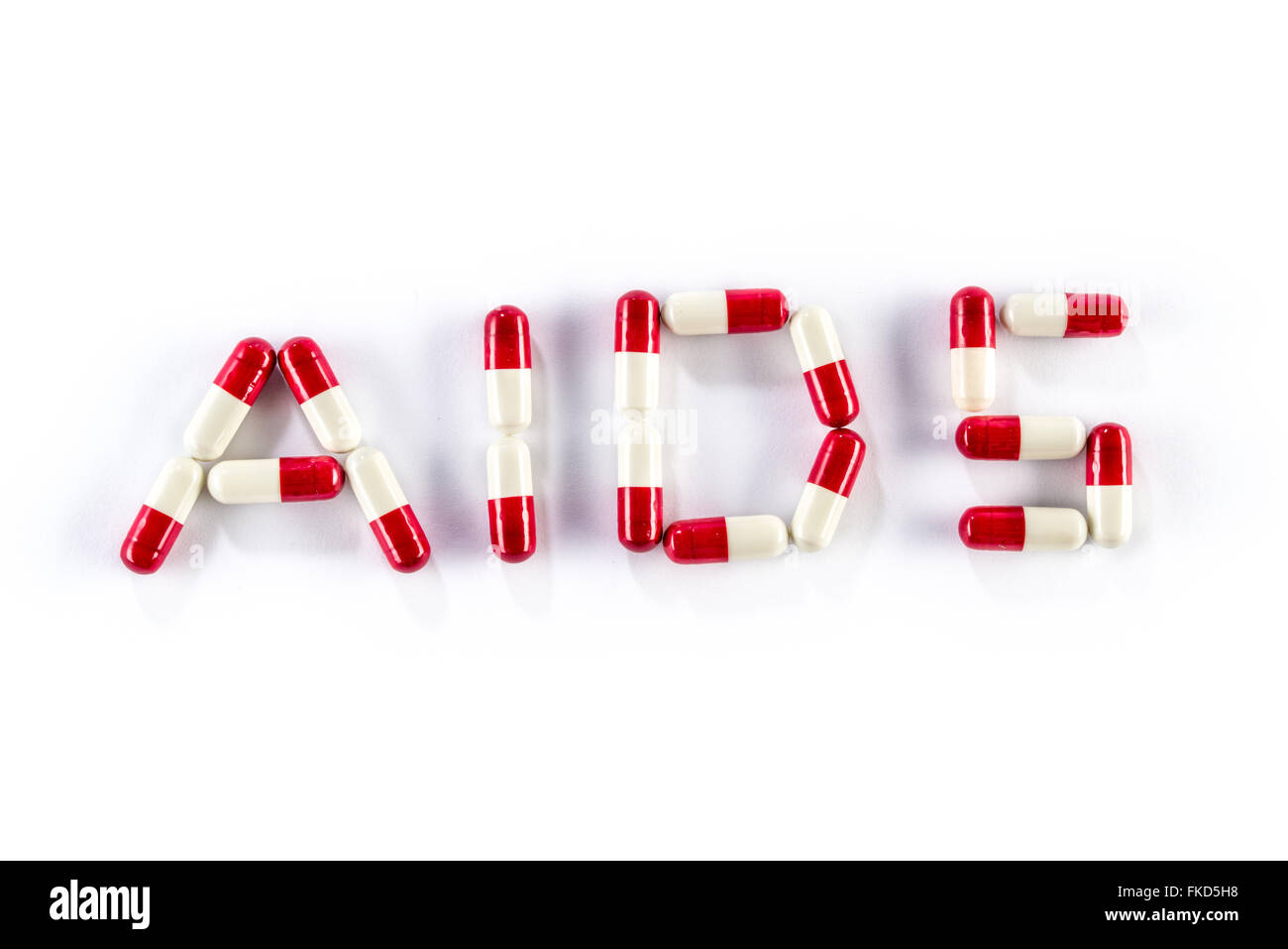 red with white capsule in AIDS WORLD, HIV medication Stock Photo - Alamy