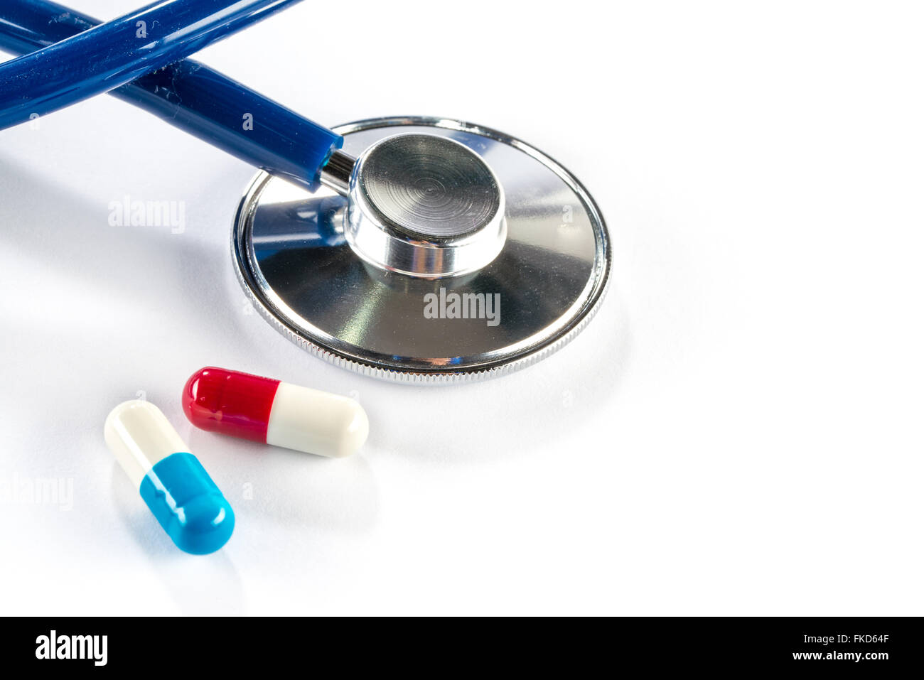 capsule with Stethoscope and pill cardiology sickness medication treat Stock Photo