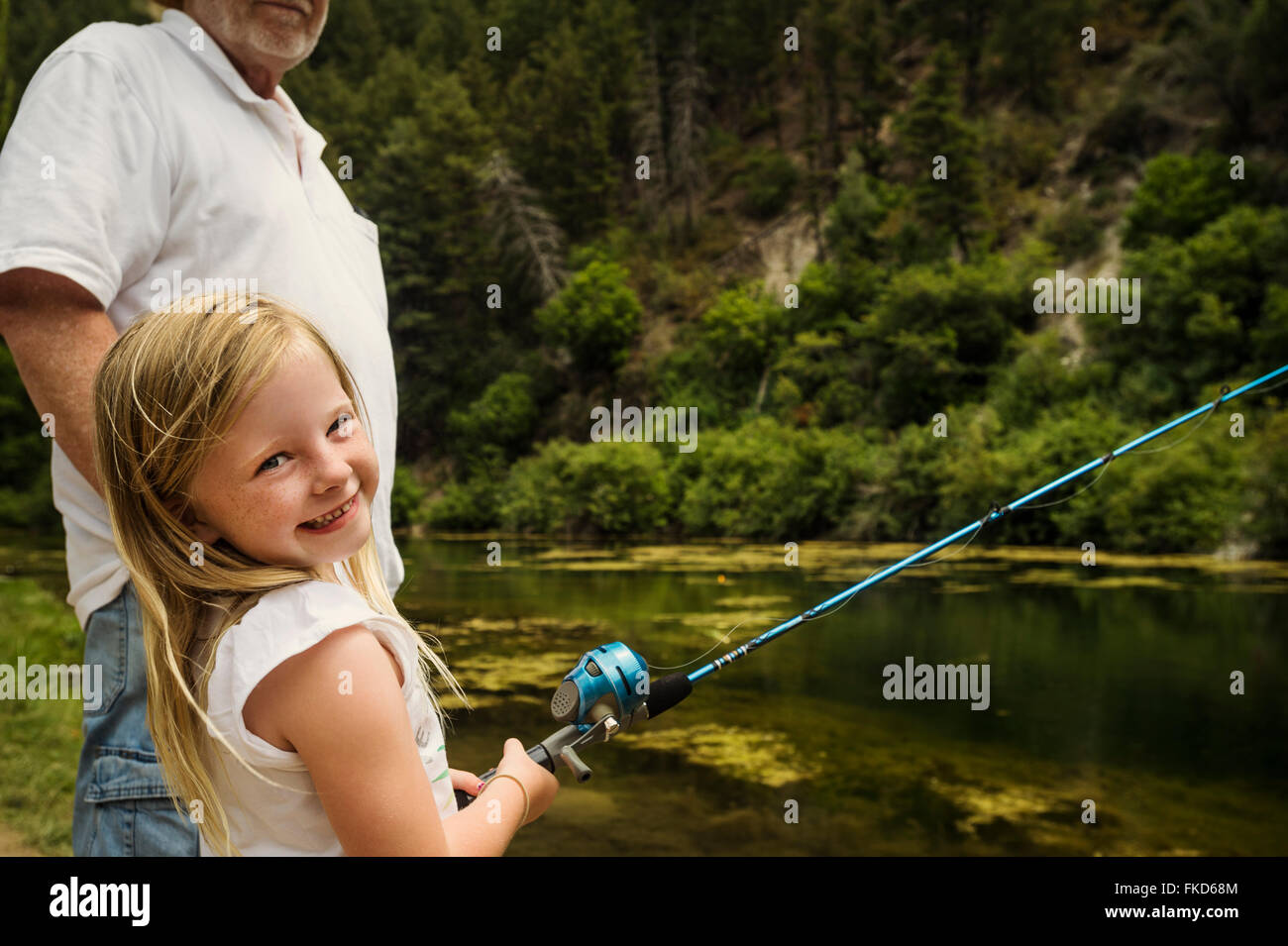Girl fishing grandfather hi-res stock photography and images - Alamy